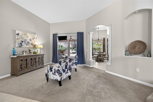 111 Falling Water Dr, Brandon, FL 33511 - sitting room featuring carpet floors, arched walkways, a chandelier, and decorative columns