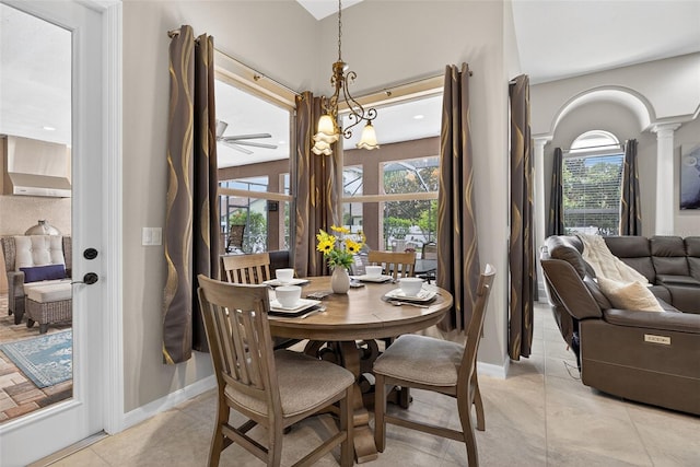 111 Falling Water Dr, Brandon, FL 33511 - dining room with light tile patterned floors and ornate columns