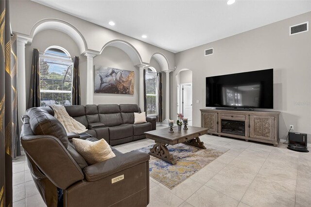 111 Falling Water Dr, Brandon, FL 33511 - living area with decorative columns, recessed lighting, and light tile patterned flooring