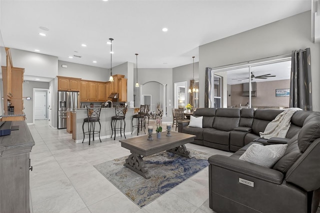 111 Falling Water Dr, Brandon, FL 33511 - living room with recessed lighting, a ceiling fan, and a chandelier