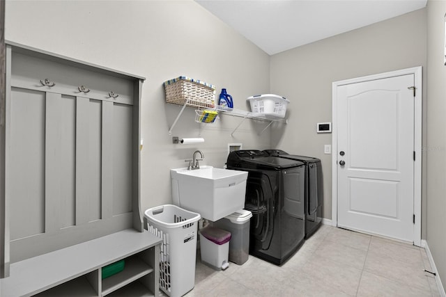 111 Falling Water Dr, Brandon, FL 33511 - laundry area featuring separate washer and dryer and light tile patterned floors