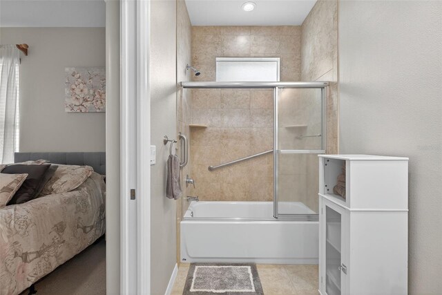 111 Falling Water Dr, Brandon, FL 33511 - bathroom with connected bathroom, shower / bath combination with glass door, and tile patterned flooring