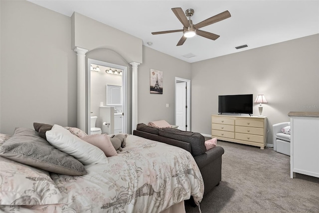 111 Falling Water Dr, Brandon, FL 33511 - bedroom with carpet, decorative columns, a ceiling fan, and ensuite bath