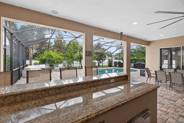 111 Falling Water Dr, Brandon, FL 33511 - view of patio with outdoor lounge area, an outdoor pool, outdoor dining area, and glass enclosure