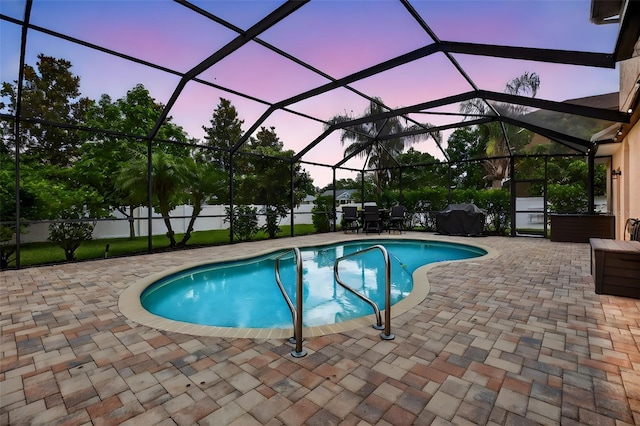 111 Falling Water Dr, Brandon, FL 33511 - pool at dusk with a patio area and a lanai