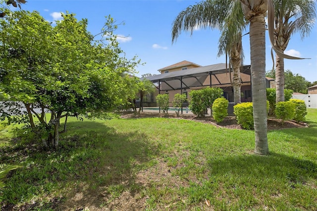 111 Falling Water Dr, Brandon, FL 33511 - view of green lawn featuring glass enclosure and an outdoor pool