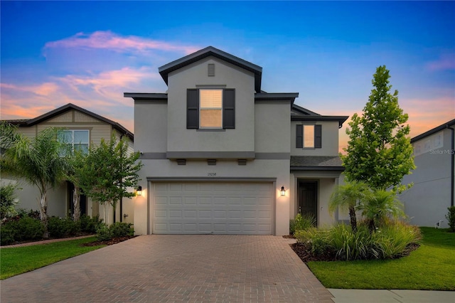 19238 Old Spanish Rd, Tampa, FL 33647 - traditional-style house featuring decorative driveway, stucco siding, and a garage