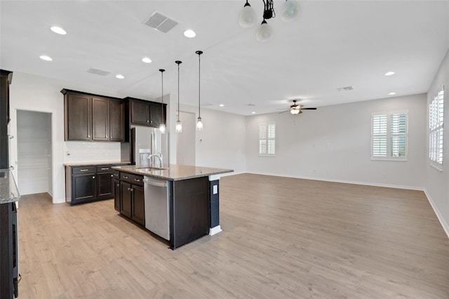 19238 Old Spanish Rd, Tampa, FL 33647 - kitchen with dishwasher, fridge with ice dispenser, a sink, ceiling fan, and healthy amount of natural light