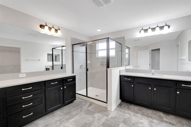 19238 Old Spanish Rd, Tampa, FL 33647 - bathroom with a shower stall and two vanities