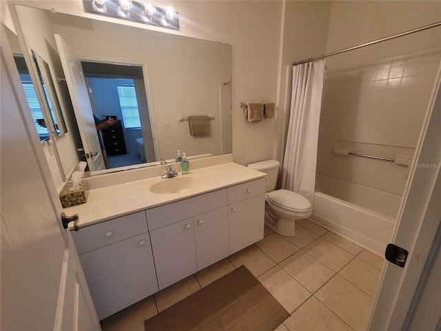 611 Tremont Greens Ln, Sun City Center, FL 33573 - bathroom with toilet, vanity, tile patterned flooring, and shower / bath combination with curtain