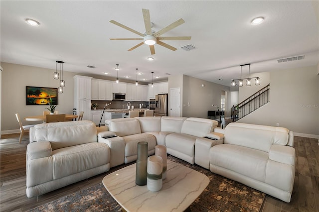 3091 King Fern Dr, Wimauma, FL 33598 - living room featuring a ceiling fan, baseboards, wood finished floors, recessed lighting, and stairway