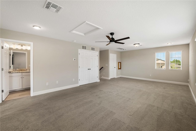 3091 King Fern Dr, Wimauma, FL 33598 - unfurnished bedroom with carpet flooring, baseboards, attic access, connected bathroom, and a ceiling fan