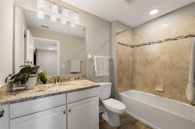 3091 King Fern Dr, Wimauma, FL 33598 - bathroom featuring wood finished floors, toilet, vanity, and shower / bath combination
