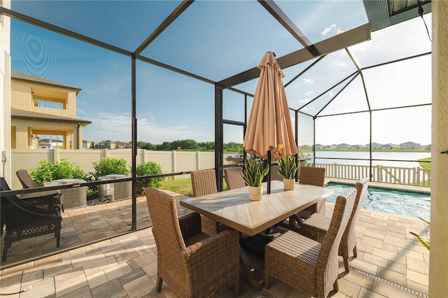 3091 King Fern Dr, Wimauma, FL 33598 - sunroom featuring outdoor dining space and a water view