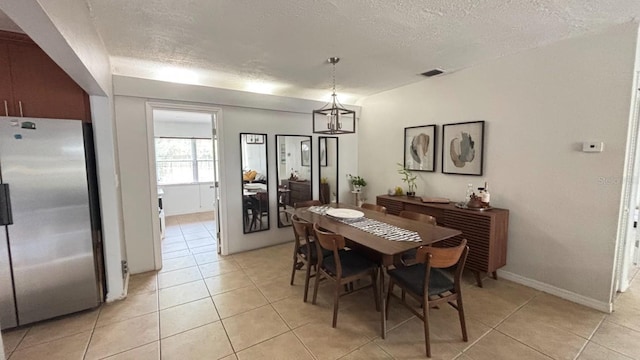 3225 Johnson St, Hollywood, FL 33021 - dining space with light tile patterned floors and a textured ceiling