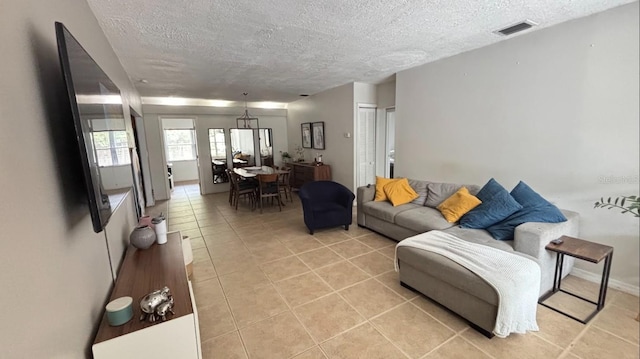 3225 Johnson St, Hollywood, FL 33021 - living area with a textured ceiling and light tile patterned floors