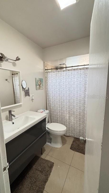 3225 Johnson St, Hollywood, FL 33021 - full bathroom with vanity, tile patterned floors, toilet, and a shower with shower curtain