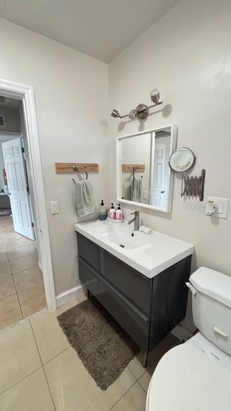 3225 Johnson St, Hollywood, FL 33021 - bathroom with tile patterned floors, vanity, toilet, and baseboards