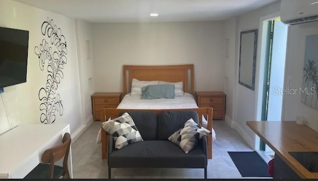3225 Johnson St, Hollywood, FL 33021 - carpeted bedroom with a wall mounted air conditioner and baseboards
