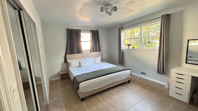 3225 Johnson St, Hollywood, FL 33021 - bedroom with light tile patterned flooring, baseboards, and a closet