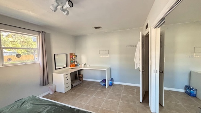 3225 Johnson St, Hollywood, FL 33021 - laundry room with light tile patterned flooring and baseboards
