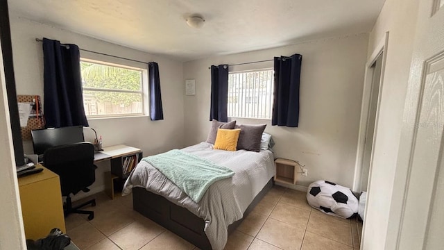 3225 Johnson St, Hollywood, FL 33021 - bedroom featuring multiple windows, light tile patterned floors, and a desk