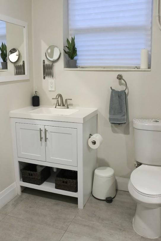 3225 Johnson St, Hollywood, FL 33021 - half bath featuring toilet, vanity, and baseboards