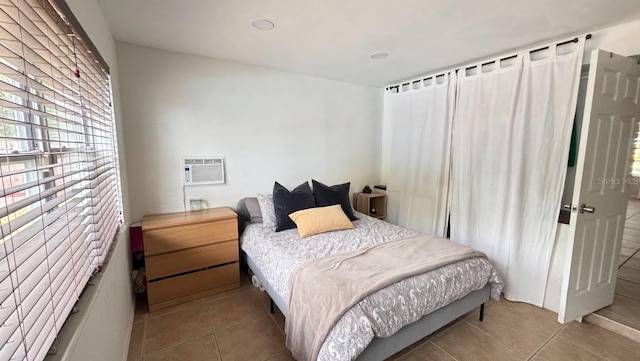 3225 Johnson St, Hollywood, FL 33021 - tiled bedroom featuring multiple windows and a wall unit AC