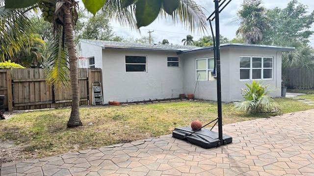 3225 Johnson St, Hollywood, FL 33021 - back of property with stucco siding and a patio area