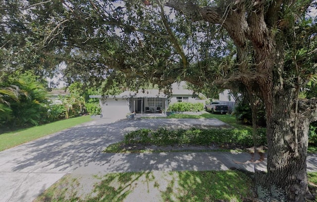 3225 Johnson St, Hollywood, FL 33021 - obstructed view of property featuring concrete driveway