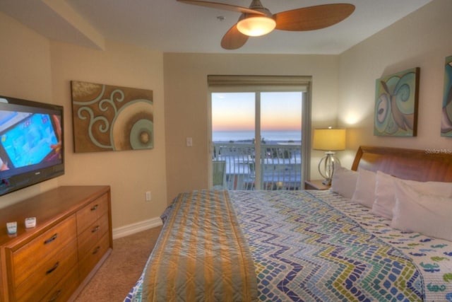 11605 Gulf Blvd Unit 506, Saint Petersburg, FL 33706 - carpeted bedroom with a water view, access to exterior, a ceiling fan, and baseboards