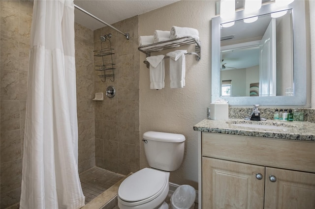 11605 Gulf Blvd Unit 506, Saint Petersburg, FL 33706 - full bath with vanity, toilet, a textured wall, and tiled shower
