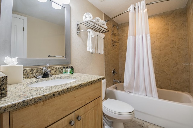 11605 Gulf Blvd Unit 506, Saint Petersburg, FL 33706 - bathroom featuring vanity, shower / tub combo with curtain, toilet, a textured wall, and tile patterned floors