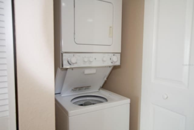 11605 Gulf Blvd Unit 506, Saint Petersburg, FL 33706 - laundry area featuring stacked washing machine and dryer
