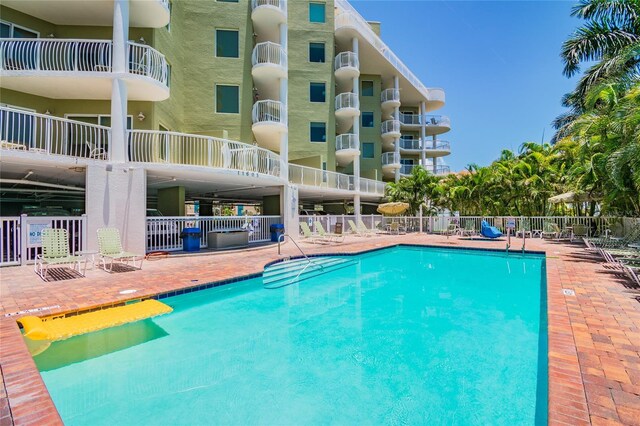 11605 Gulf Blvd Unit 506, Saint Petersburg, FL 33706 - community pool with a patio area