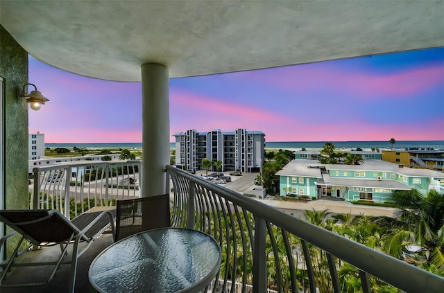 11605 Gulf Blvd Unit 506, Saint Petersburg, FL 33706 - balcony at dusk featuring a water view