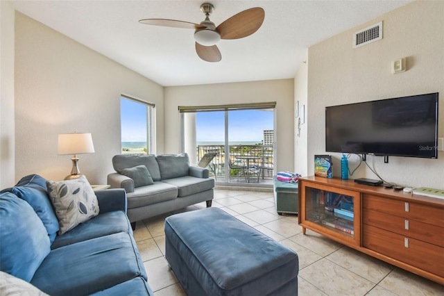 11605 Gulf Blvd Unit 506, Saint Petersburg, FL 33706 - living area featuring ceiling fan and light tile patterned flooring