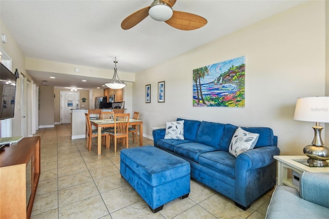 11605 Gulf Blvd Unit 506, Saint Petersburg, FL 33706 - living area featuring a ceiling fan, light tile patterned floors, and baseboards