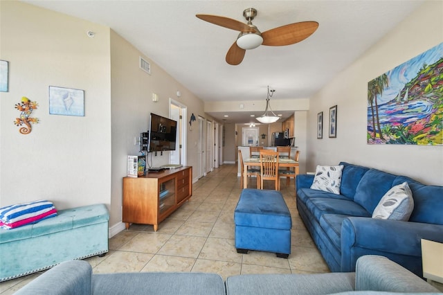 11605 Gulf Blvd Unit 506, Saint Petersburg, FL 33706 - living area featuring a ceiling fan and light tile patterned flooring