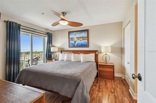 11605 Gulf Blvd Unit 506, Saint Petersburg, FL 33706 - bedroom featuring access to exterior, baseboards, wood finished floors, and ceiling fan