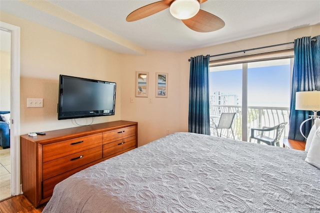 11605 Gulf Blvd Unit 506, Saint Petersburg, FL 33706 - bedroom featuring access to exterior, wood finished floors, and ceiling fan