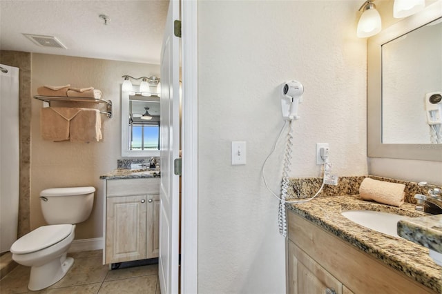 11605 Gulf Blvd Unit 506, Saint Petersburg, FL 33706 - bathroom with vanity, tile patterned flooring, and toilet