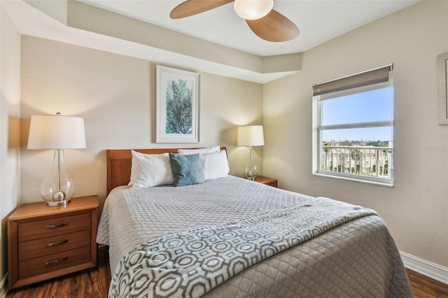 11605 Gulf Blvd Unit 506, Saint Petersburg, FL 33706 - bedroom with dark wood finished floors, baseboards, and a ceiling fan