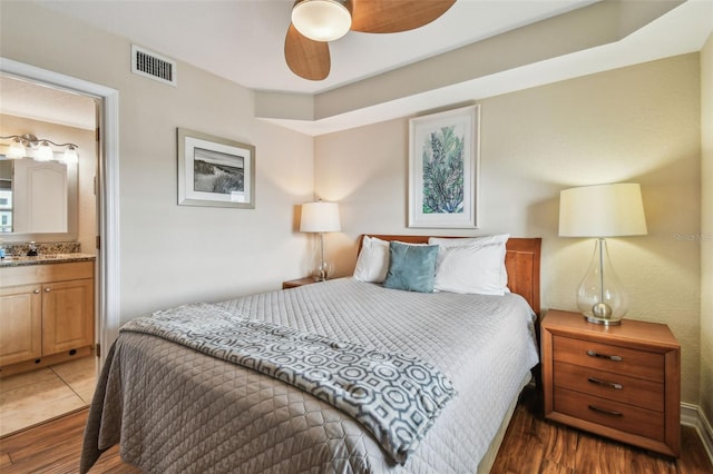 11605 Gulf Blvd Unit 506, Saint Petersburg, FL 33706 - bedroom featuring wood finished floors and connected bathroom