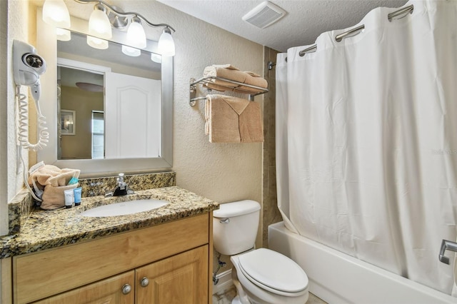 11605 Gulf Blvd Unit 506, Saint Petersburg, FL 33706 - full bath featuring a textured wall, vanity, a textured ceiling, shower / bath combo with shower curtain, and toilet