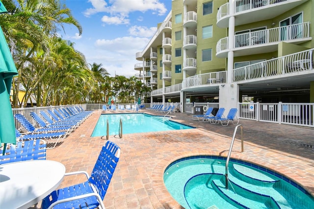 11605 Gulf Blvd Unit 506, Saint Petersburg, FL 33706 - community pool with a community hot tub and a patio area