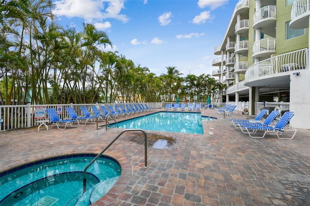 11605 Gulf Blvd Unit 506, Saint Petersburg, FL 33706 - community pool with a community hot tub and a patio area