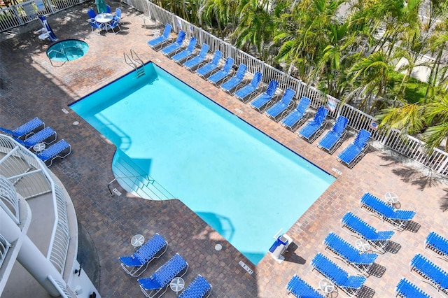 11605 Gulf Blvd Unit 506, Saint Petersburg, FL 33706 - community pool featuring a community hot tub and a patio area