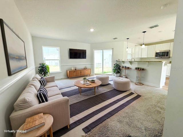 222 Carpenters Way Unit 71, Lakeland, FL 33805 - living area with light colored carpet and baseboards