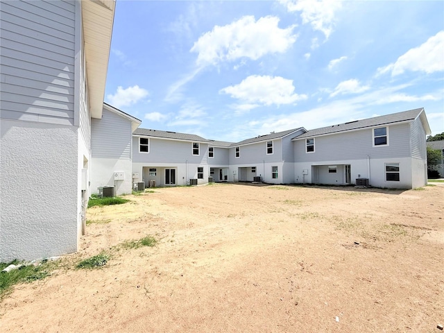222 Carpenters Way Unit 71, Lakeland, FL 33805 - rear view of house with central AC unit